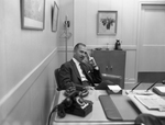 Frank Pace, Jr. at desk