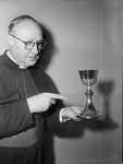 Msgr. E.G. Langenhorst with knights of Columbus chalice