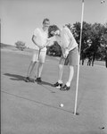 Joan Metz and Madelon Leonard playing golf
