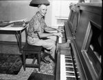 John Vanderlee and old upright piano
