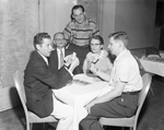 Bridge tournament left - right Barry Crane, Clarence Strouse, Byron Greenberg (standing) Mrs. Eliot Evans and Jack Blair