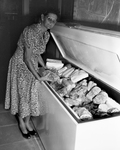 Mrs. Henson with home freezer