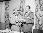 B. C. Reich Jr., left, and Mayor Tom McCann with Housing Authority check