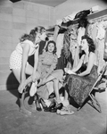 Cynthia Cory, Charlotte Barker and Doris Labovitz, rest their feet after performance of "Can-Can"