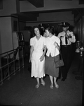 Mrs. Fowler, enters police station for questioning, with daughter, Elizabeth and unidentified policeman