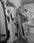 Deedy Irwin, sizes up closet full of costume she wears in Casa Manana's "Can-Can"