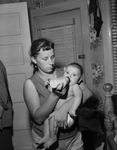 Mrs. Shirley Walden with baby, Anthony, after she shot her stepfather-in-law