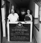 Glenn Wilson, and Miss Anita Leonard, stand by marker east of Nocona by Tony Slaughter