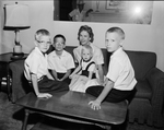 Mrs. Charles H. Haws, with four sons, Riley, Russell, Roy, and Randall
