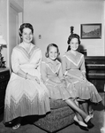 Mrs. Dick Hazelwood, pictured with her daughters, are wearing the square dance dresses they will wear in New Mexico