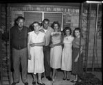 Mr. and Mrs. J. L. Thomas, Junior, with children Henery Thomas, Mrs. Betty Fraley, Edna Thomas, and Sue Thomas family of slain boy by Tony Slaughter