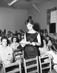 Mrs. James L. McDowell reads a list of liberal delegates