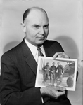 B. B. Baker with cherished photo