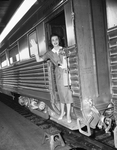 Although Glenda Moses - Miss Fort Worth of 1958 - is poised and in command of any situation, she boarded the train for Amarillo