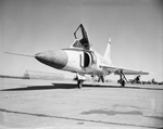 Ranged along the edge of a work ramp at Convair, wooden blast deflectors prevent piston-engined "propwash" and jet blasts
