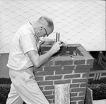 Ocelot to Lose Home in Chimney: Rev. Warren A. Flynn Looks Down Chimney for Unwelcomed Intruder