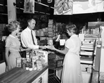 Mr. and Mrs. John P. Hicks and Their Son Mark Do Their Grocery Shopping