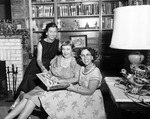 Mrs. Joe H. Davis, Mrs. H. J. Koehler and Mrs. Frank Retzloff, Look Over First Yearbook of Bluebonnet Garden Club