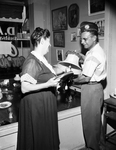 Mrs. Berdie Slate and Robert C. Whinery Readying Merchandise at the Disabled American Veterans Thrift Shop