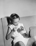 Betsy Bond feeding kitten