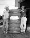 W. W. Flanagan and J. J. Thweatt with County's First Bale of Cotton