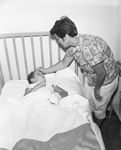 Mrs. Paul D. Paschal with son Paul Paschal Jr. at hospital