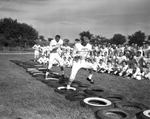 Arlington Heights football players. John Hornburg and Joe Lee Burns during drills by Al Panzera