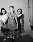 Mrs. Jack Rice, daughter Jill, modeling uniform, and Mrs. D. G. Wilds