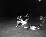 Paschal-Amarillo football action. Mal Whitesett, Amarillo, with ball while Jimmy Dunn goes in for tackle by Al Panzera