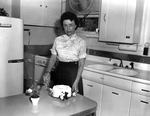 Mrs. G. K. Massengill with Angel Food Cake that won Farm and Ranch recipe award by Bud Fichte