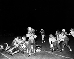 Poly-Wichita Falls football action. Dickie Turner, Wichita Falls, Poly Jim Wilson, 71, and Pruitt Benson, action by Al Panzera