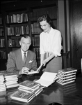 Reverend Gaston Foote with Mrs. C. Keith Beyette autographing book "The Transformation"