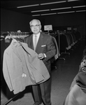 Phil Mallin, manager Bill Benton Clothiers with suit
