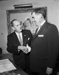 Norman P. Mason, Washington, FHA commissioner, greeted by Edward J. Dee on campaign for more quality housing
