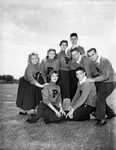 Poly cheerleaders. Left to right, back row, are Harvene Nauert, Dolly Dollins, Judy Taylor, Barry Brannen, Fred Hubbard and Johnny Couch; front row, Beverly Bland and Ronnie Burton