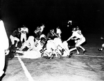 Texas Christian University (TCU)-Arkansas football action. Robert Lily, 72, Ramon Armstrong, Larry Dawson, 10 in pile up with Donnie Stone, Arkansas carrying ball by Al Panzera