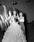 Miss Flame. Janice Fancher, left, being crowned Miss Flame by Joanna Taulman