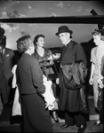 Mrs. Burton Carter, Mrs. J. Lee Johnson, III and Bishop Sheen at airport