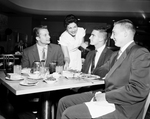 Texas Tech football players arrive. Gerald Seemann, Floyd Dellinger and Gene Bentley being served by Nettie Moreland at Wyatt's Cafeteria