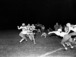 Arlington Heights, Waco football action. Cary Stratton with ball going for touchdown with Ronnie Vance trying to tackle, Steve Bender, 83, Billy Snow, 4 and Bob Simpson coming in to assist by Al Panzera