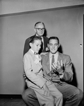 Judge Harold Craik, standing, with Ray Dillards, 12, Company County Children's Home and Ronnie Stevenson, TCU basketball captain