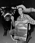 Bill Holcomb Seminole Future Farmers of America (FFA) with grand champion Angus steer of State Fair