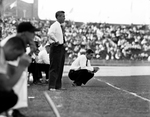 Texas Christian University (TCU)-Texas A&M football game. Series of Jim Myers at game with players and Bud Sherrod. Meyers registers his disgust by Joe McAulay