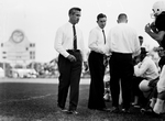 Texas Christian University (TCU)-Texas A&M football game. Series of Jim Myers at game with players and Bud Sherrod. Myers prowls with aide Bud Sherrod by Joe McAulay