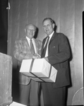 Abe Martin, right, receiving birthday present from Rudy Copeland Jr. at Frog Club meeting