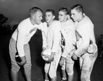 Birdville football players, posed. Coach Ray Hill with Jack Thomspon, John Moore and Marvin Applewhite