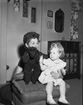 Mrs. T.G. Bigham with dau. Barbara and dog "Little Bit" after saved them from fire