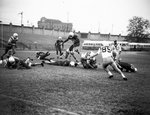 Football action, Amon Carter Riverside vs. Jefferson in Dallas by Bob Bain