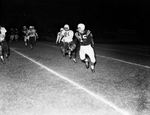 North Side-Tech Football. Don Ford, with ball with Richard Hungerford, Tech, in pursuit by Al Panzera