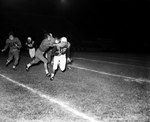 North Side-Poly football action. Ronny Holliday, Poly, tackling Don Ford, North Side by Al Panzera